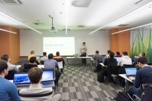 young-computer-technology-students-on-code-programming-class-have-presentation-SBI-322334742